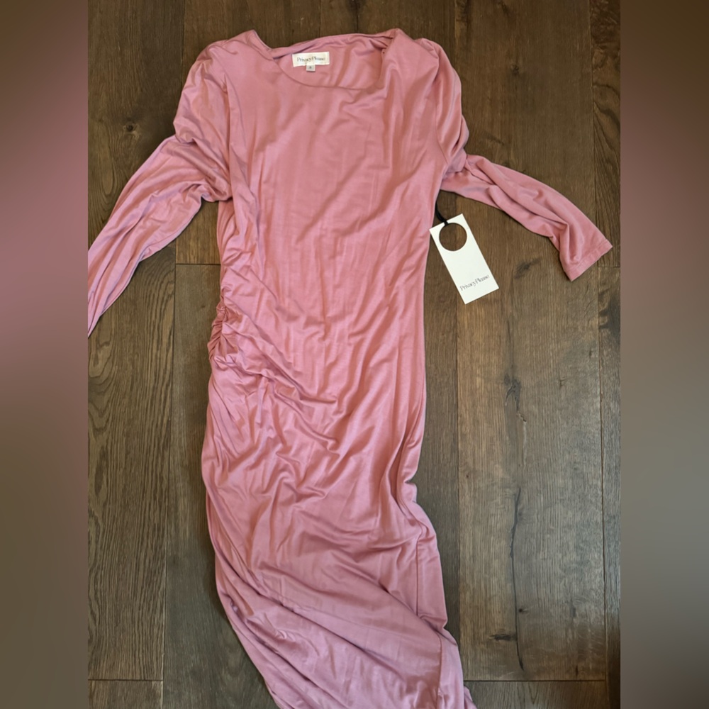 Never worn. Soft pink. Rouched and fitted  asymmetrical hem